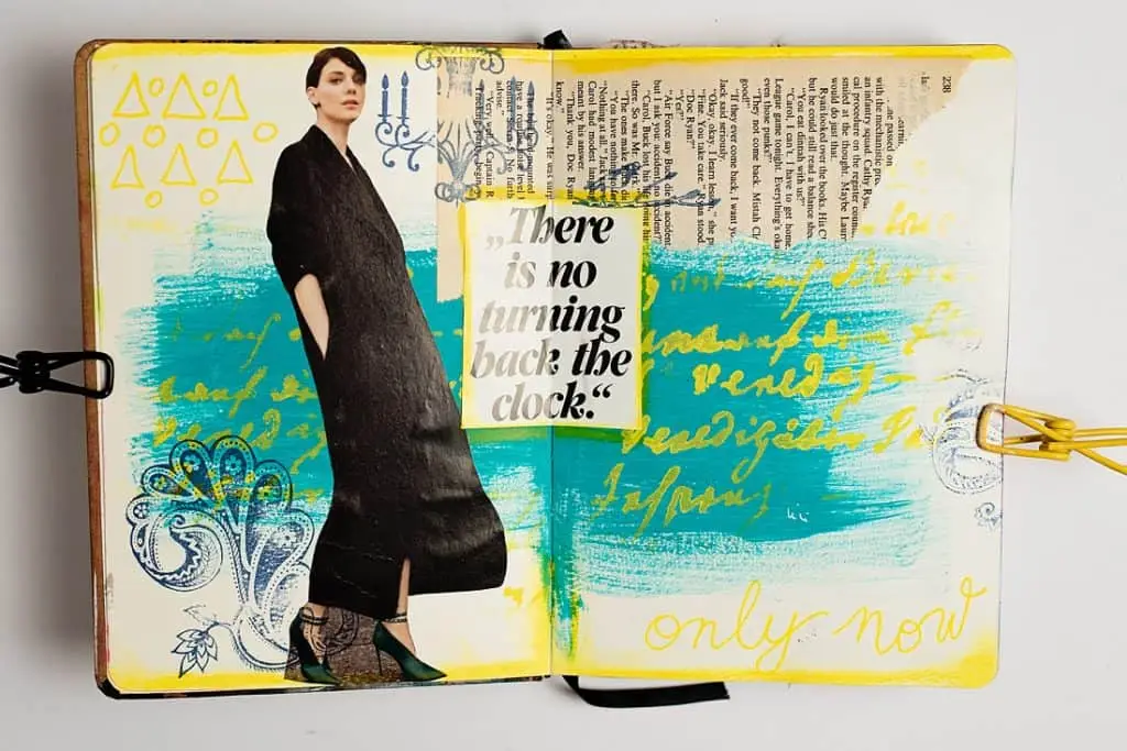 AN ART JOURNAL SPREAD WITH MAGAZINE PHOTO AND ACRYLIC PAINT