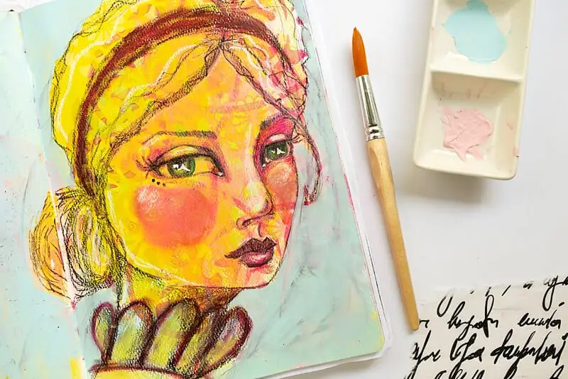 an art journal page with woman face