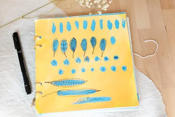 art journal page with leaves doodles