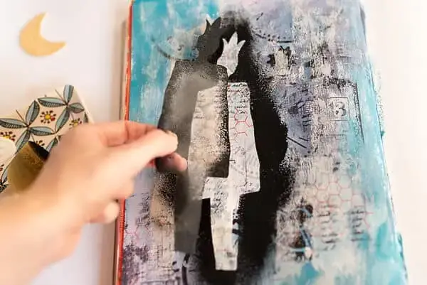 picking up the stencil from the page