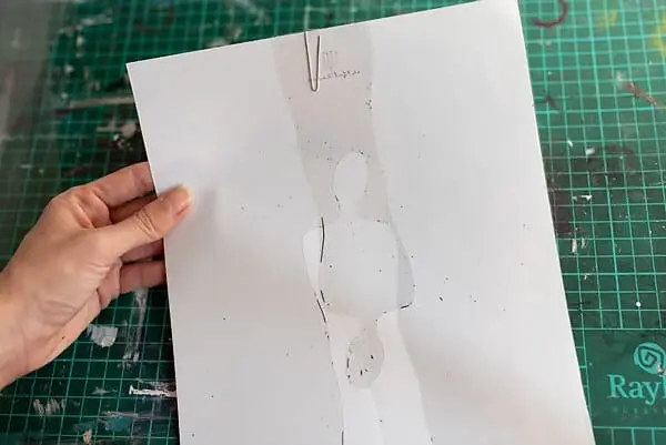 hand holding a diy stencil