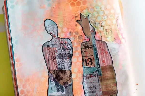 human figures paper cut outs on a page