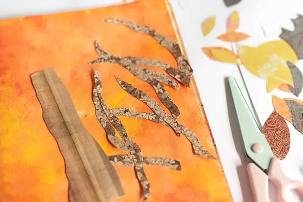 paper cut-outs, art journal and scissors