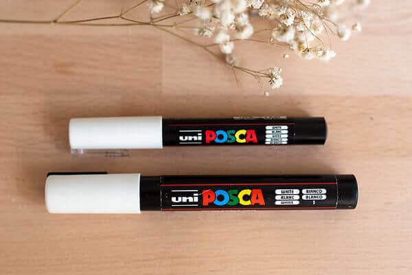 two white posca pens