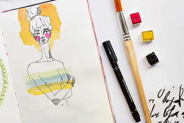 watercolor girl in an art journal