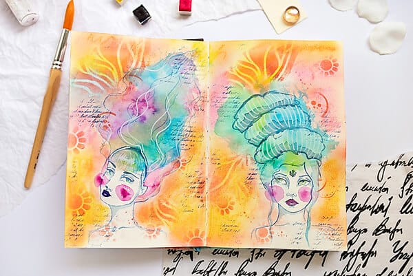 two watercolor girls in an art journal