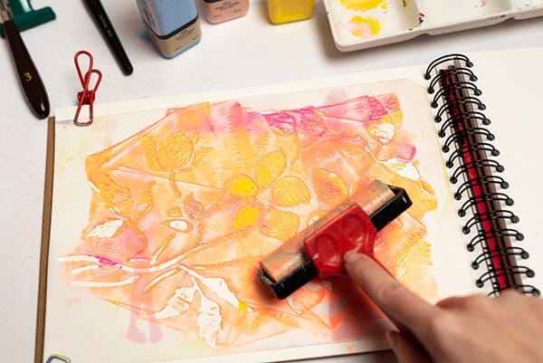 applying acrylic paint using a brayer