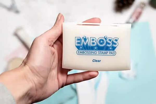 hand holding emboss ink pad