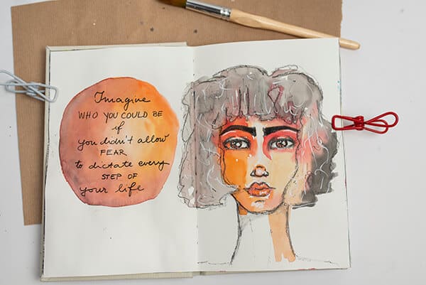 watercolor painting of a girl in an art journal