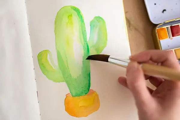 painting the cactus with darker watercolor