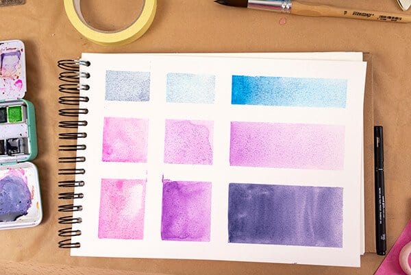 watercolor shapes in an art journal