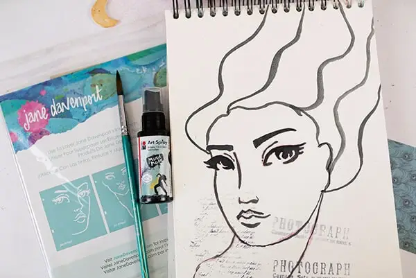 woman face painted with ink