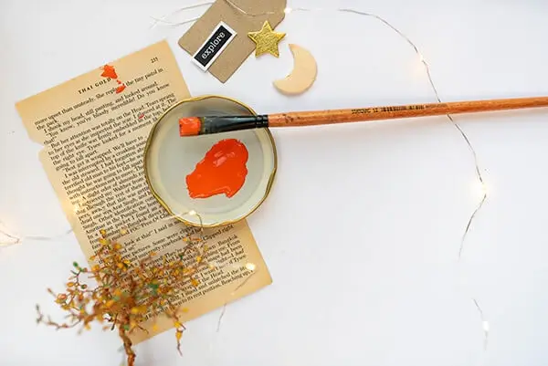 red paint and a brush