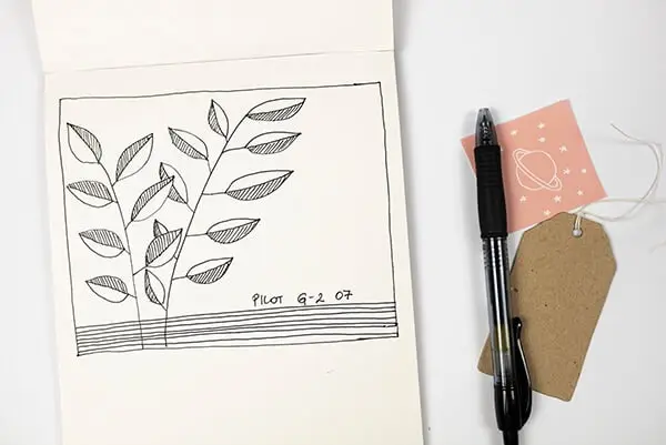 leaf doodles and a black pen