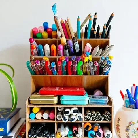 shelf with pens and markers