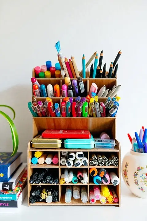 shelf with pens and markers