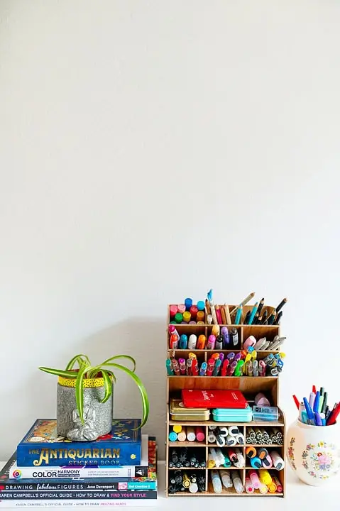 tiny pen shelf on a desk
