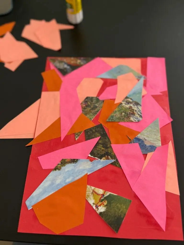 Geometric paper shapes in pink, peach, and orange adding depth to art journal collage