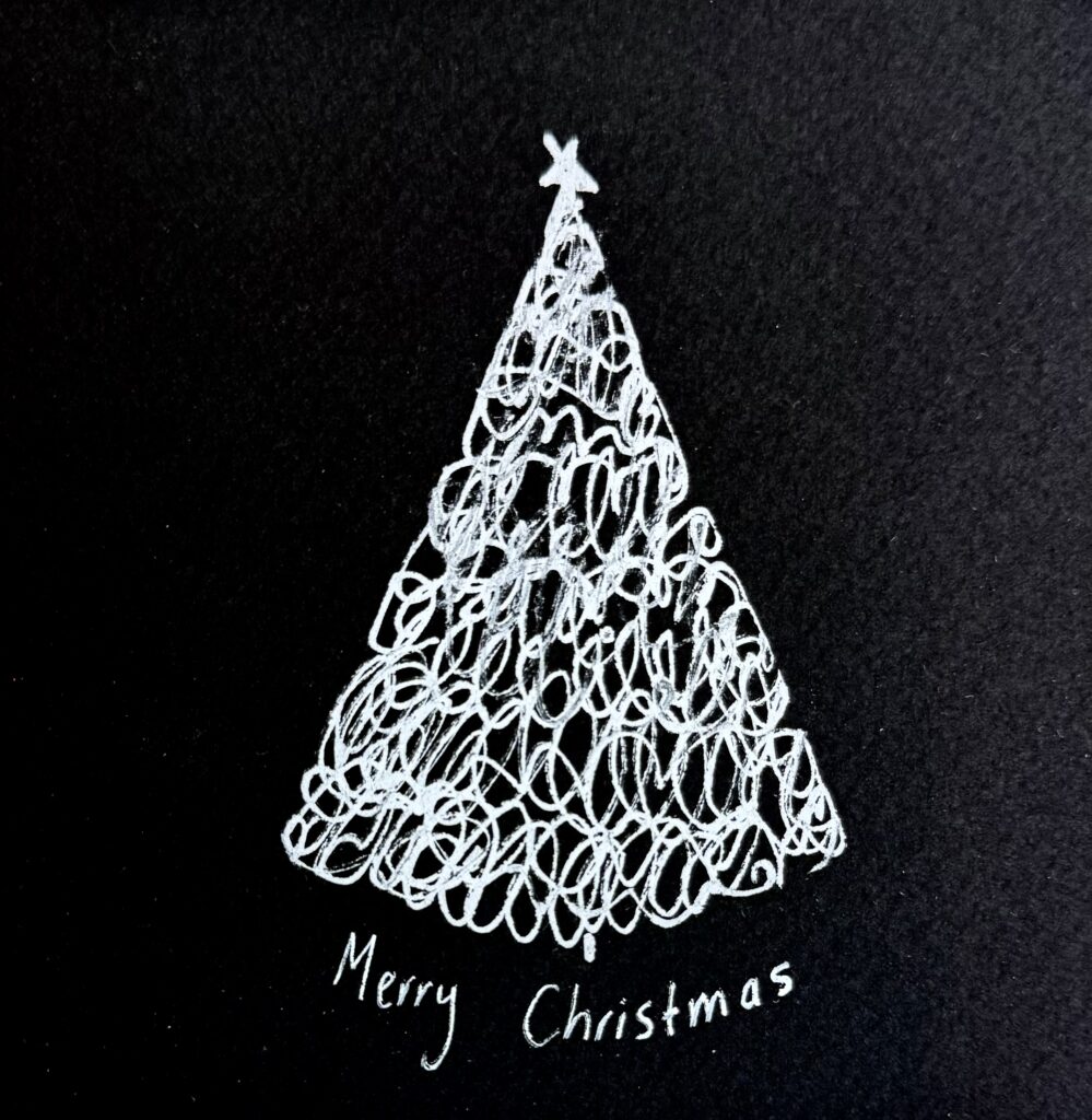 handmade Christmas tree made with silver pen and black paper