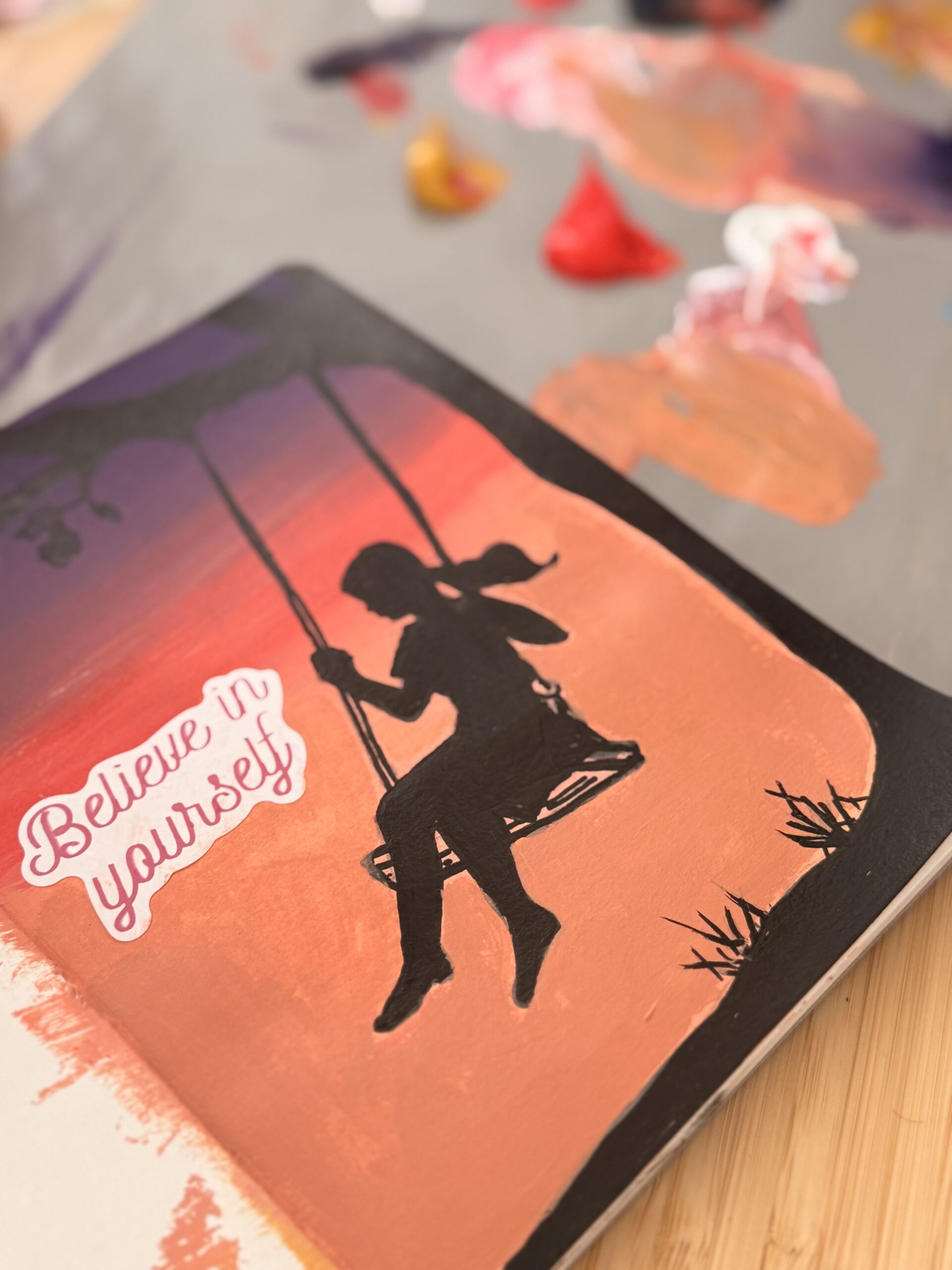 art journal of an acrylic painting of a girl in the sunset.