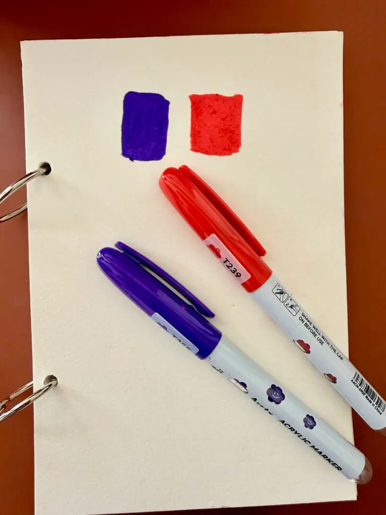 purple and red marker on a white thin paper